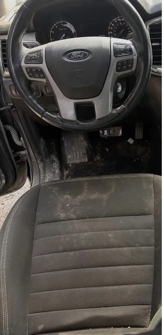 Ford steering wheel and seat before and after detailing before