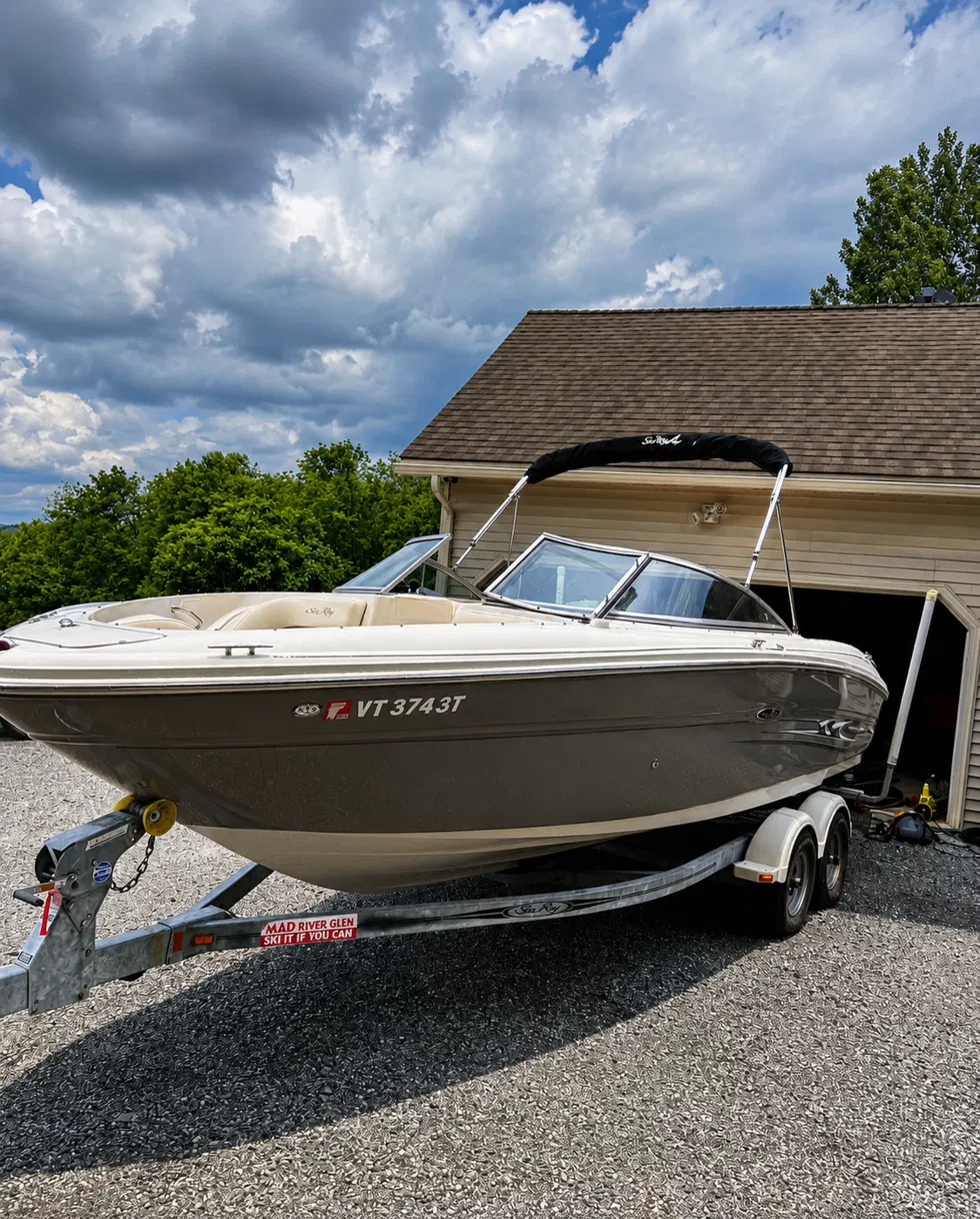 Detailed white Sea Ray boat on a trailer